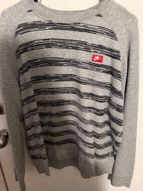 Nike Gray Crewneck Sweatshirt with Black Stripe Pattern and Red Logo